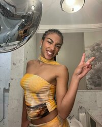Photo by Megan Ria on May 23, 2024. May be a selfie of 1 person, makeup, sundress and choker..jpg