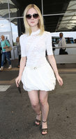Elle-Fanning-in-White-Dress-at-Nice-Airport--07.jpg