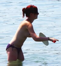 young_redhead_topless_at_the_beach_4.jpg